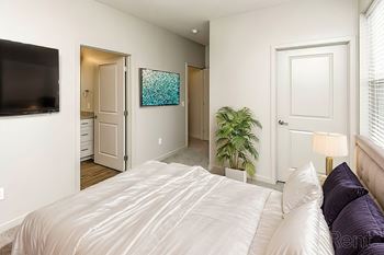 Bedroom With wall mounted TV at Sandstone Villas Apartments, Omaha, NE 68116