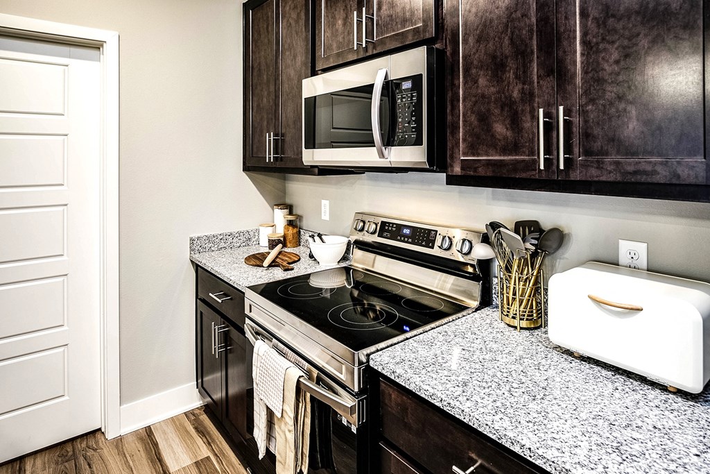 Kitchen with stainless steel appliances at Sterling Prairie Trail North in Ankeny, IA