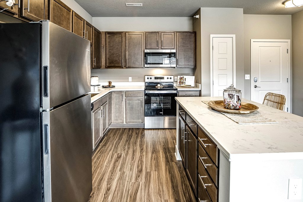 Kitchen with stainless steel appliances at Sterling Prairie Trail in Ankeny, IA