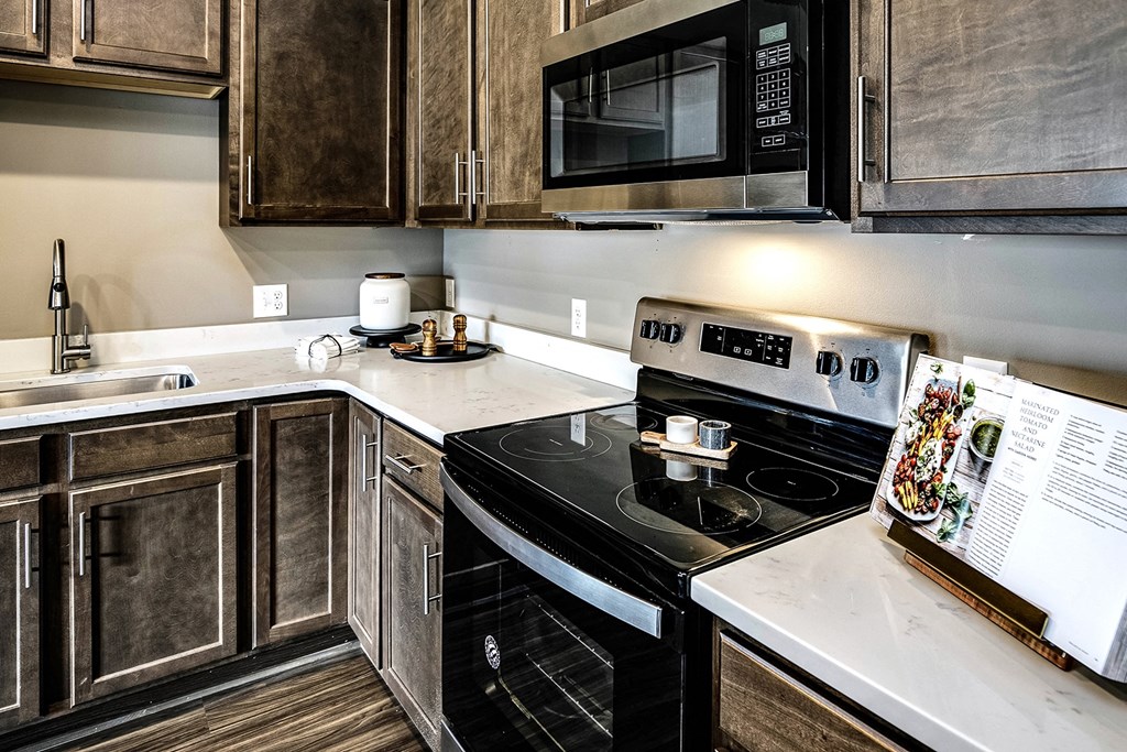 Kitchen with stainless steel appliances at Sterling Prairie Trail in Ankeny, IA