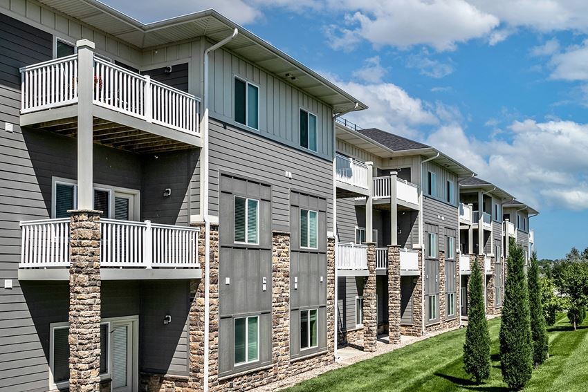 an exterior view of an apartment building with balconies