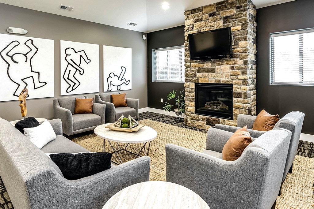 Clubhouse with TV and cozy fireplace at Tamarin Ridge in Lincoln, NE