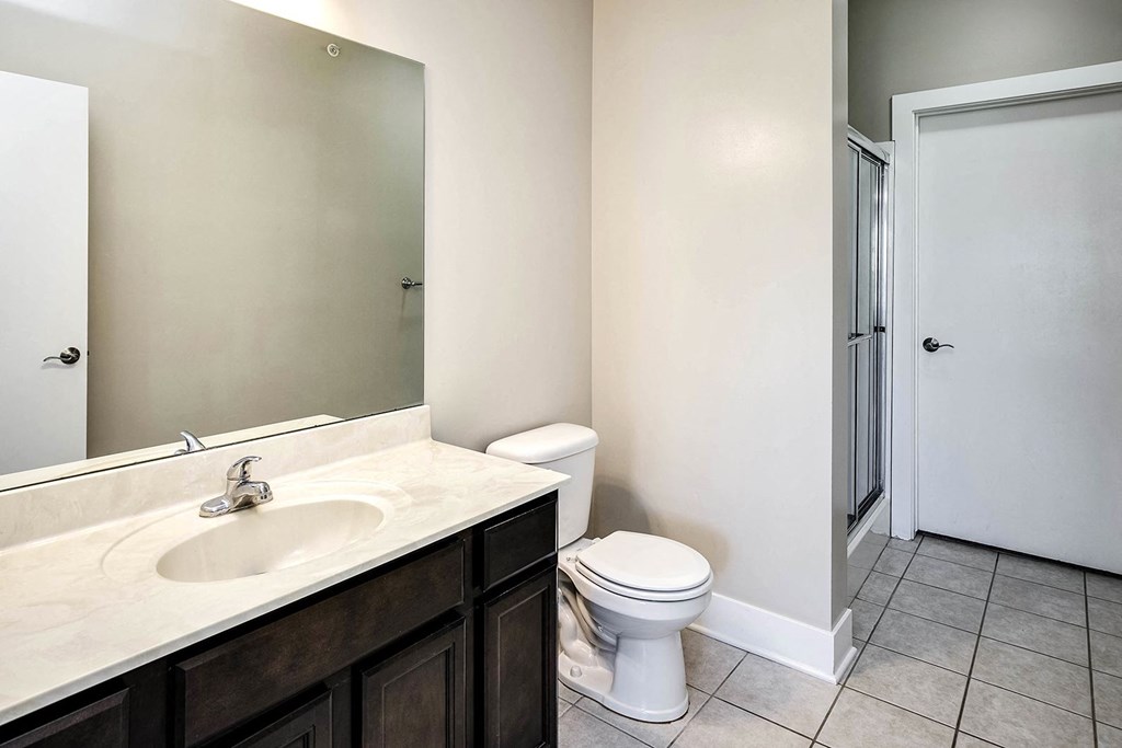 a bathroom with a sink toilet and a shower
