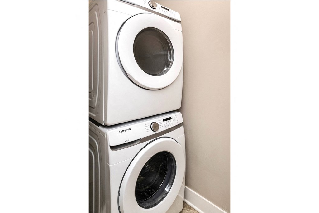 a washing machine and a dryer in a laundry room