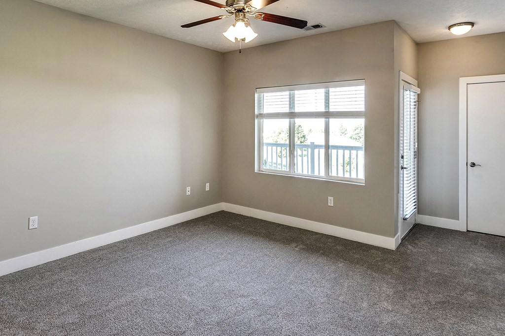 Living Room with natural light at Tamarin Ridge in Lincoln, NE