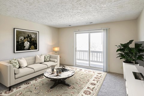 A living room with a couch, coffee table, and a painting on the wall.