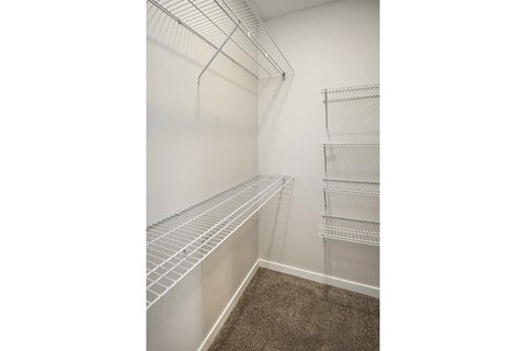 Spacious one and two-bedroom apartments featuring three interior schemes, granite countertops, stainless steel appliances, large kitchens, high-end lighting, vinyl plank flooring and much more at The Brink at Ridgeview in Plattsmouth, NE