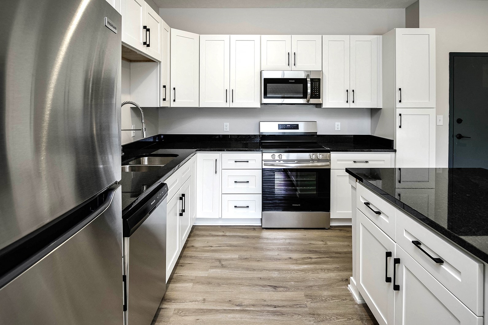 Spacious one and two-bedroom apartments featuring three interior schemes, granite countertops, stainless steel appliances, large kitchens, high-end lighting, vinyl plank flooring and much more at The Brink at Ridgeview in Plattsmouth, NE