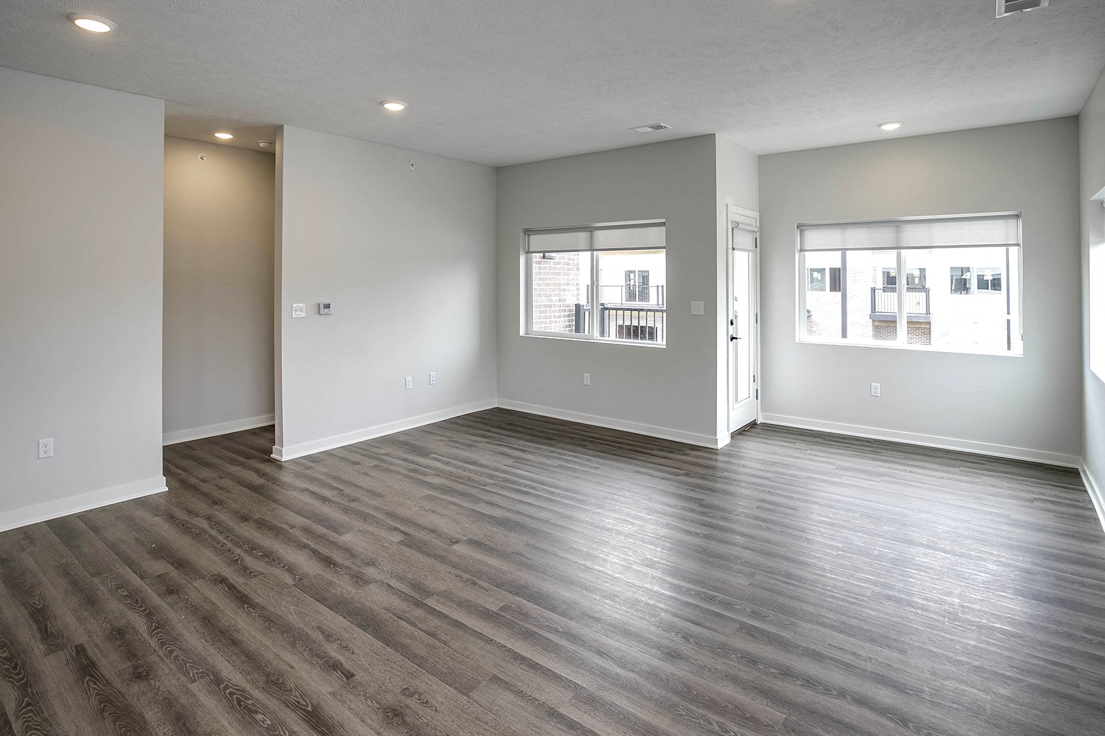 Spacious one and two-bedroom apartments featuring three interior schemes, granite countertops, stainless steel appliances, large kitchens, high-end lighting, vinyl plank flooring and much more at The Brink at Ridgeview in Plattsmouth, NE