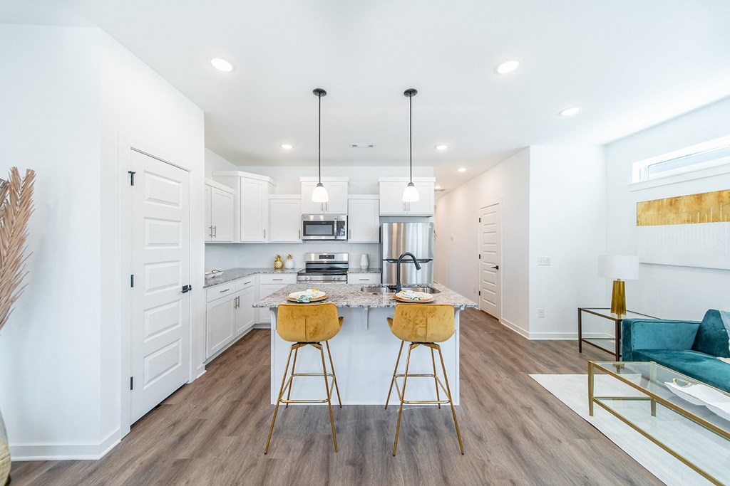 Living Room with custom LVT flooring at The Grove in Rogers, AR