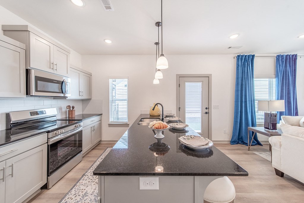 Kitchen with custom granite countertops at The Grove in Rogers, AR
