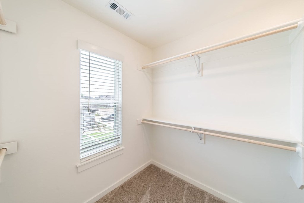 Walk-In closet with a window at The Grove in Rogers, AR