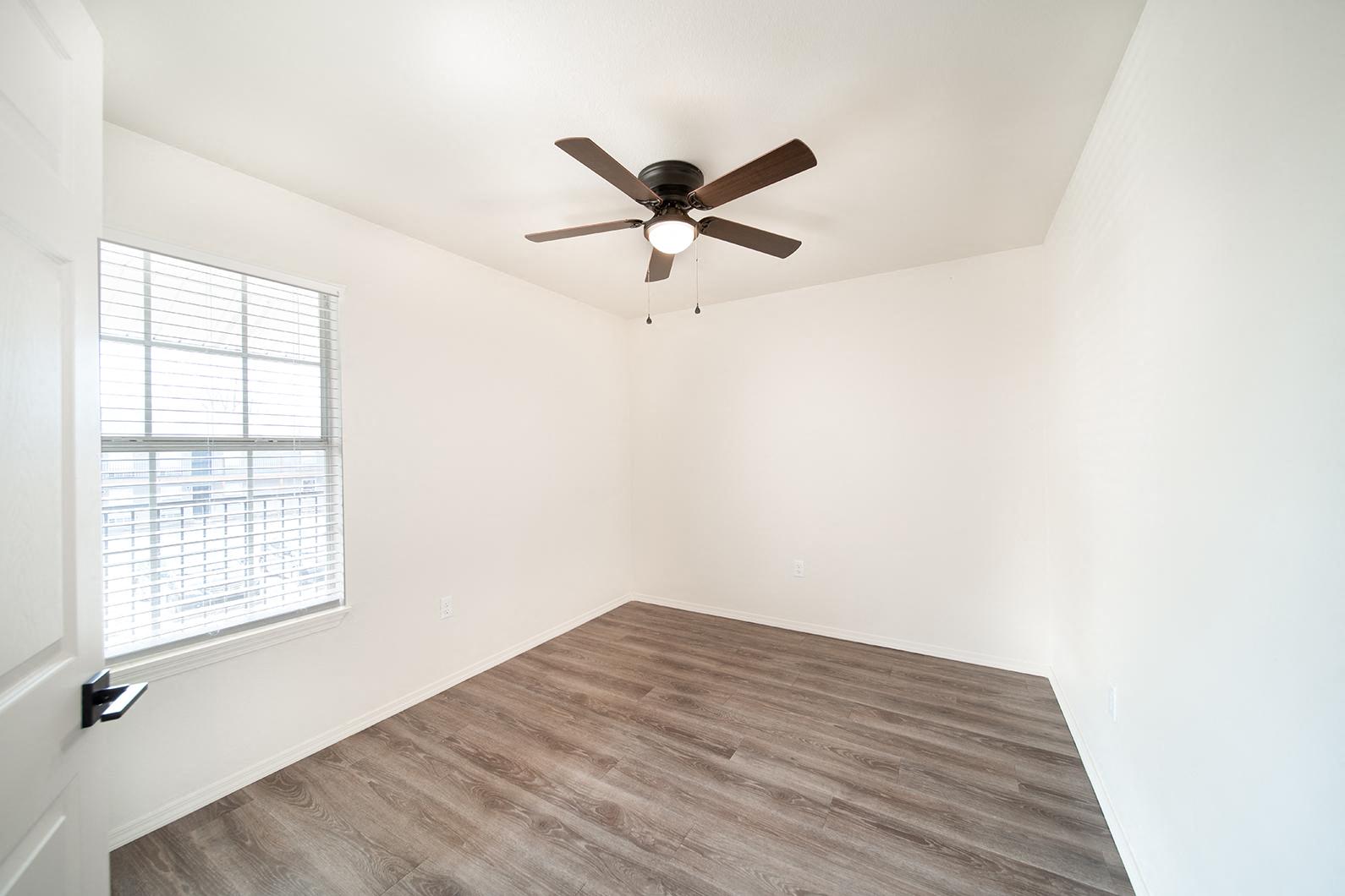 Newly remodeled one and two-bedroom floor plans with premium appliances, custom cabinetry, quartz countertops, premium LVT flooring, and in-unit washer and dryer at The Grove on Berry in Springdale, AR.