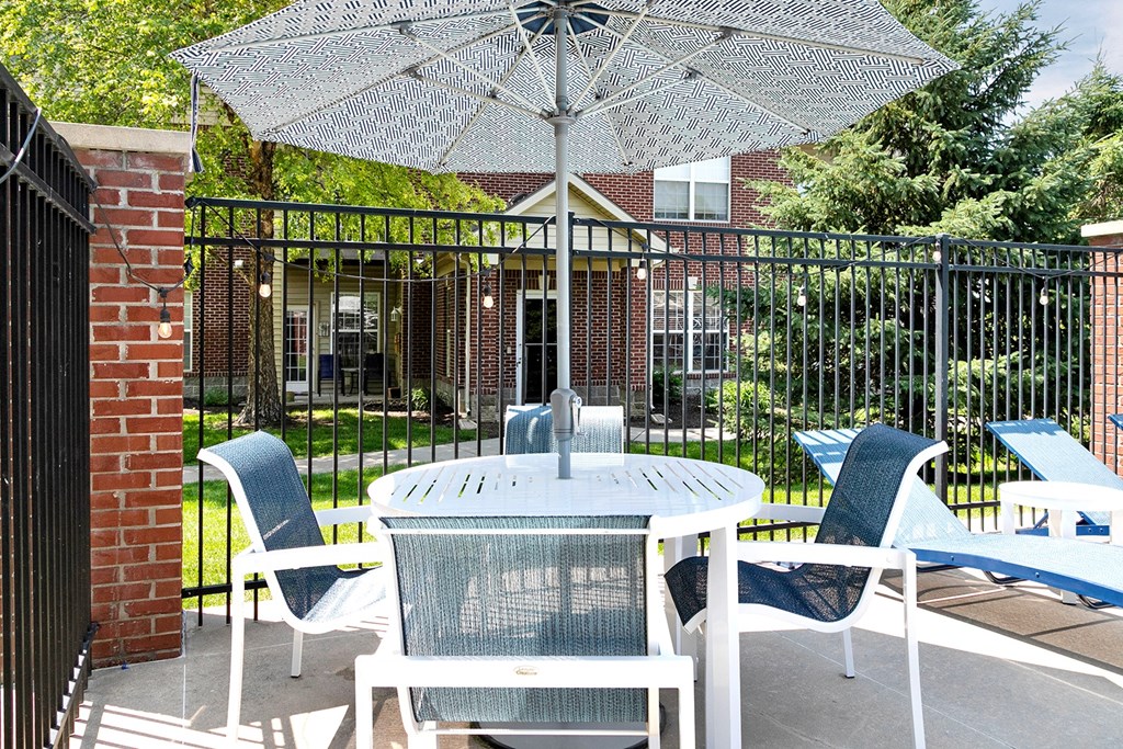 Sparkling Pool side seating at The Landings Apartments, Bellevue, NE