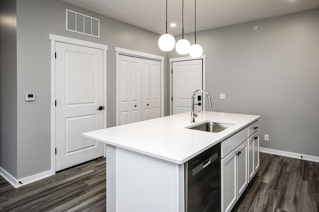 Modern one- and two-bedroom apartments featuring stainless steel appliances, high-end lighting, premium LVT flooring, granite countertops and more at The Ridgeline in Council Bluffs, IA