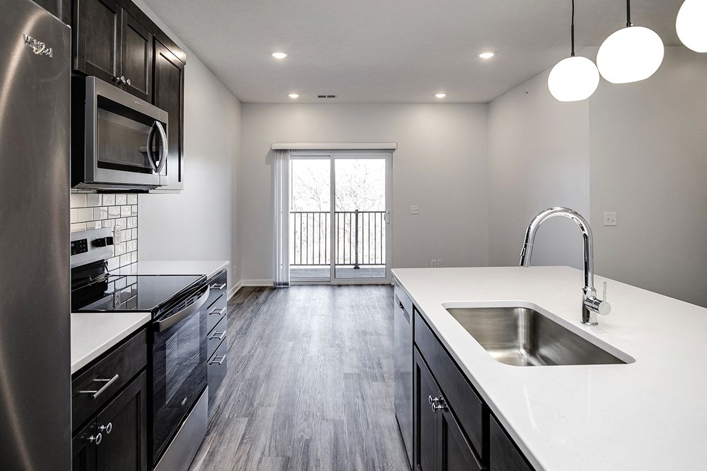 Modern one- and two-bedroom apartments featuring stainless steel appliances, high-end lighting, premium LVT flooring, granite countertops and more at The Ridgeline in Council Bluffs, IA