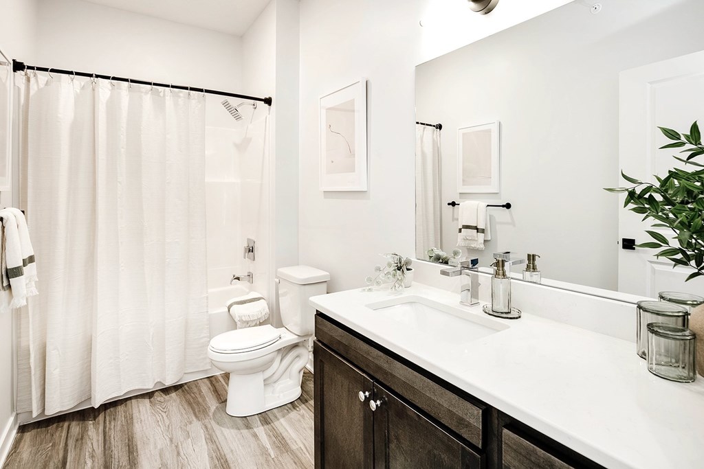 Modern one- and two-bedroom apartments featuring stainless steel appliances, high-end lighting, premium LVT flooring, granite countertops and more at The Ridgeline in Council Bluffs, IA