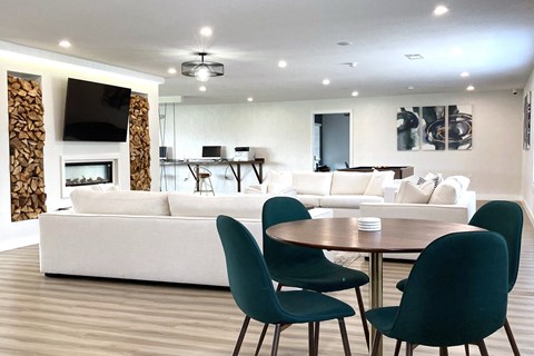 a living room and dining room with a couch and a table