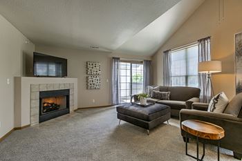 A living room with a fireplace and a couch.