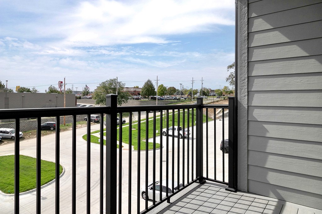 Studio, one-, two-, and three-bedroom apartment homes featuring stainless steel appliances, luxury wood-style plank flooring, walk-in closets, in-unit washer and dryer, and smart locks at VUE19 in Bellevue, NE