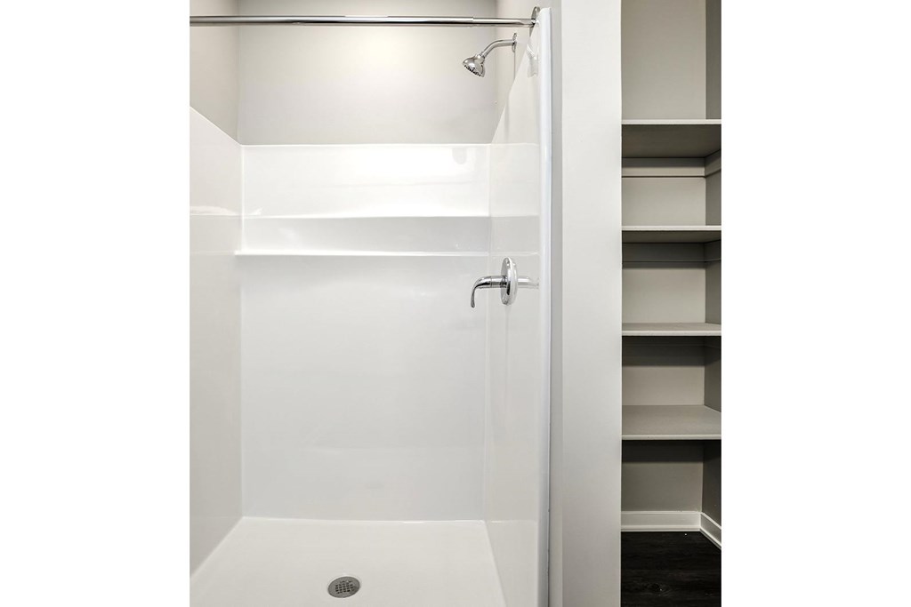 Studio, one-, two-, and three-bedroom apartment homes featuring stainless steel appliances, luxury wood-style plank flooring, walk-in closets, in-unit washer and dryer, and smart locks at VUE19 in Bellevue, NE