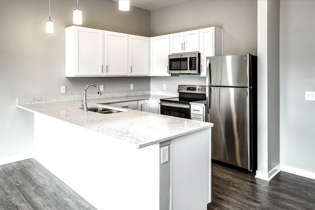 Kitchen with white cabinets at Vue 178 in Omaha, NE