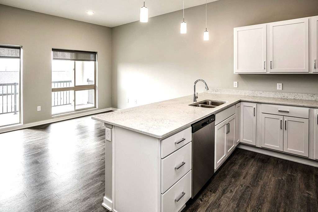 Open Kitchen with wood flooring at Vue 178 in Omaha, NE