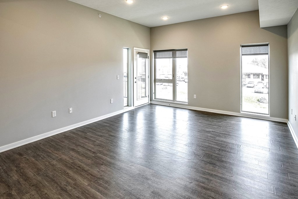 Living room with wood plank flooring at Vue 178 in Omaha, NE