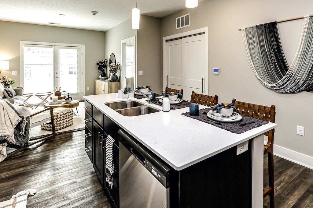 Large kitchens with quarts countertops and stainless steel appliances at The Westline at Flanagan Lake in Omaha, NE
