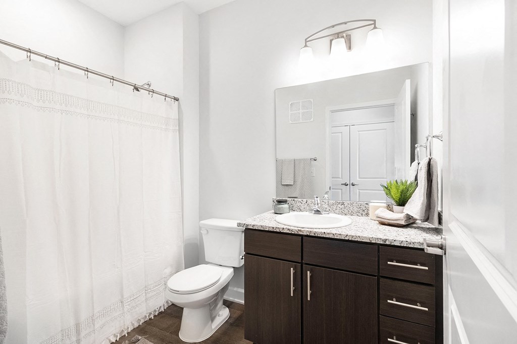 Large bathrooms with granite countertops at Page Living at Pinnacle Hills in Rogers, Ar
