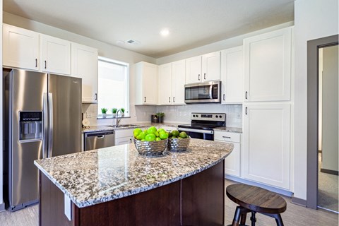Large kitchens with stainless steel appliances at Park125 West Dodge apartments in Omaha, NE