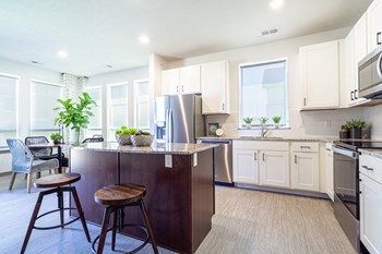 Large kitchens with stainless steel appliances at Park125 West Dodge apartments in Omaha, NE - Photo Gallery 5