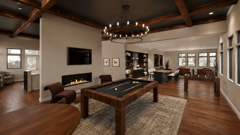 A large room with a pool table and a fireplace.