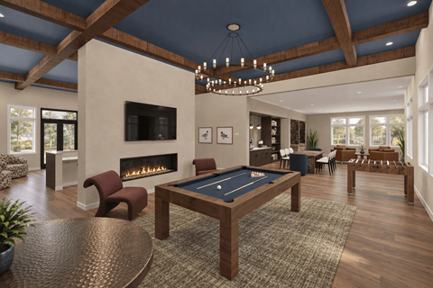 A large room with a pool table and a fireplace.