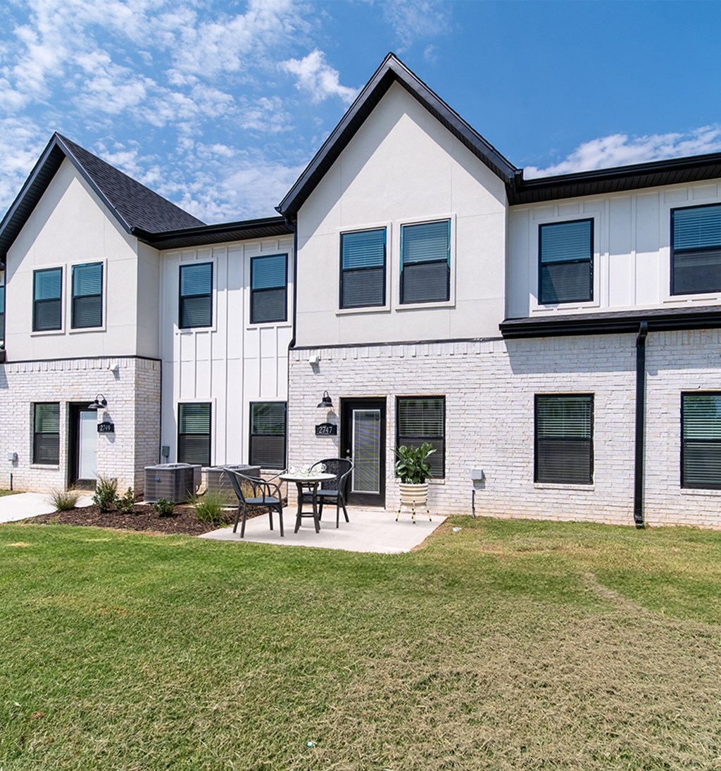 Exterior with large patio at Shadowbrooke Village in Rogers, AR