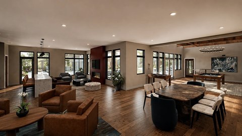 Modern clubhouse with fireplace, casual seating and dining area.