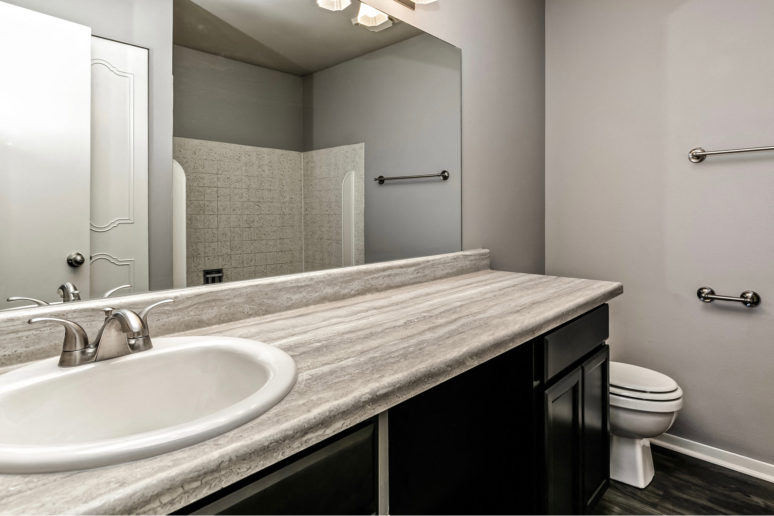 Remodeled bathroom with large vanity at Terrace Garden Townhomes