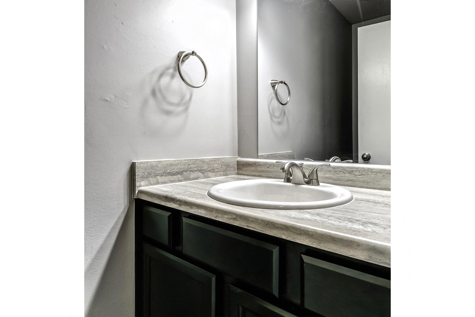 Remodeled bathroom with large vanity at Terrace Garden Townhomes
