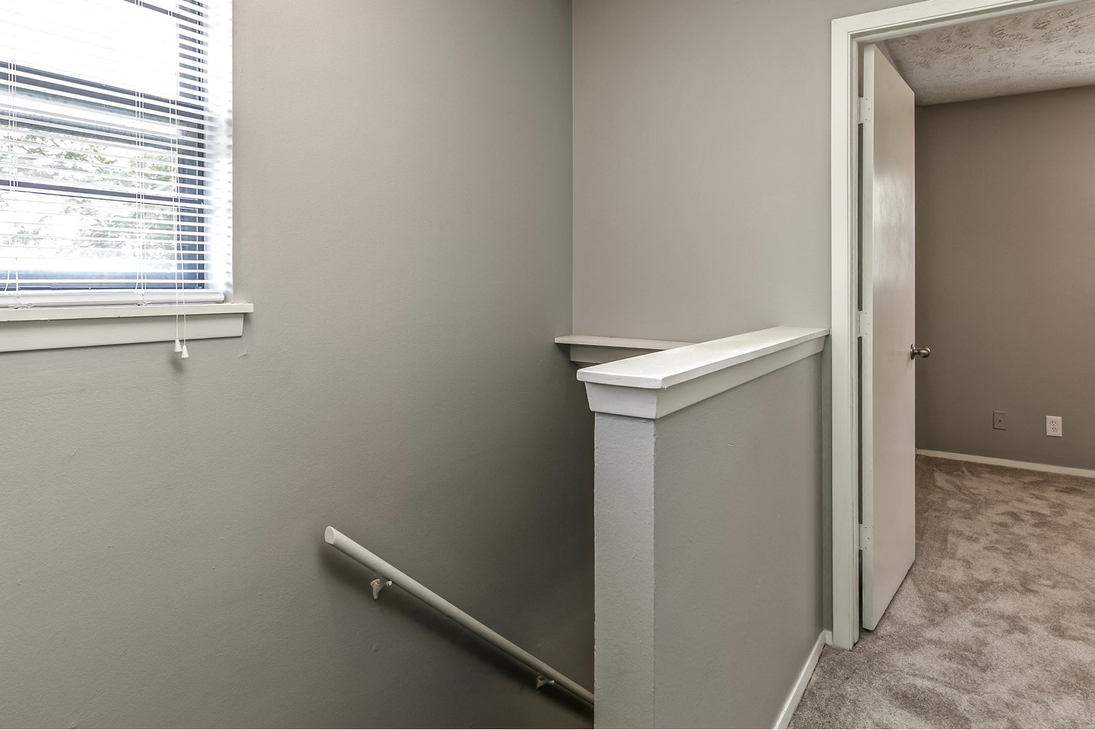 Upstairs hallway with carpet at Terrace Garden Townhomes