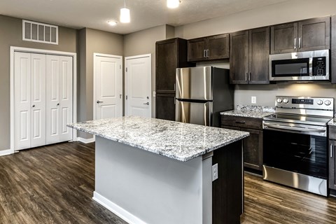 Studio, one two and three bedroom apartment homes featuring stainless steel appliances, luxury wood-style plank flooring, and in-unit washer and dryer in VUE 156 in Omaha, NE