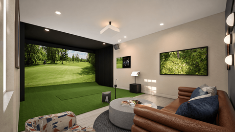 A modern living room with a large couch and a television.