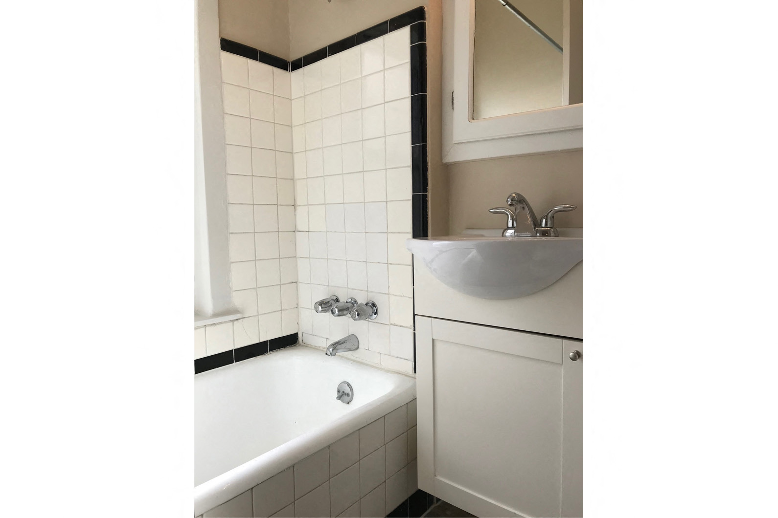 a bathroom with a tub and a sink