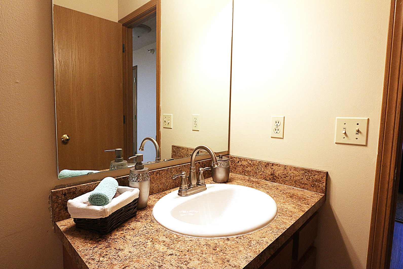a bathroom with a sink and a mirror