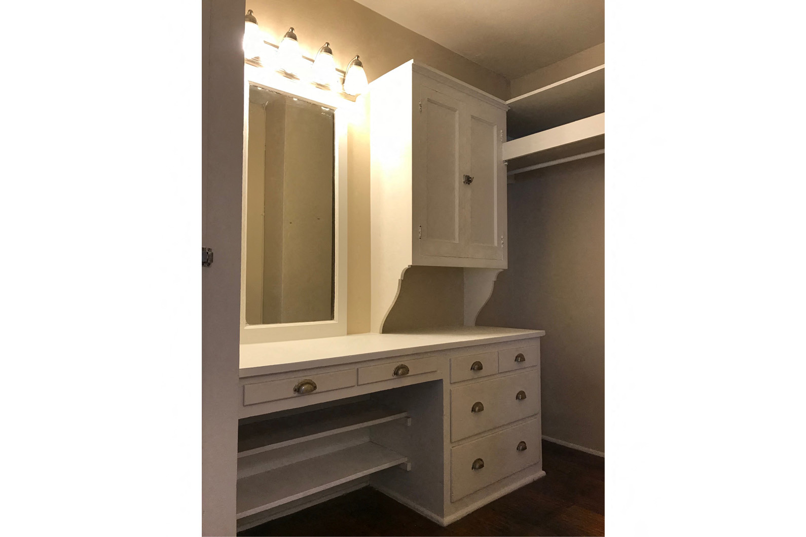 a bathroom with a vanity and a mirror