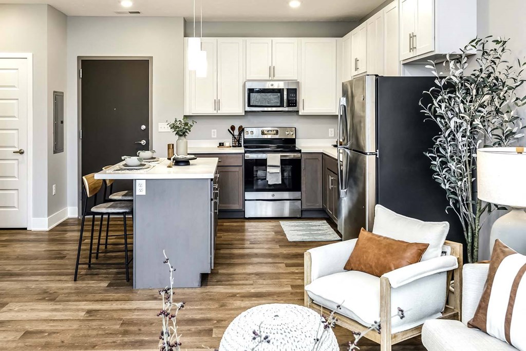 Large kitchens with two tone shaker cabinets and  stainless steel appliances at Echo Park in Omaha, NE
