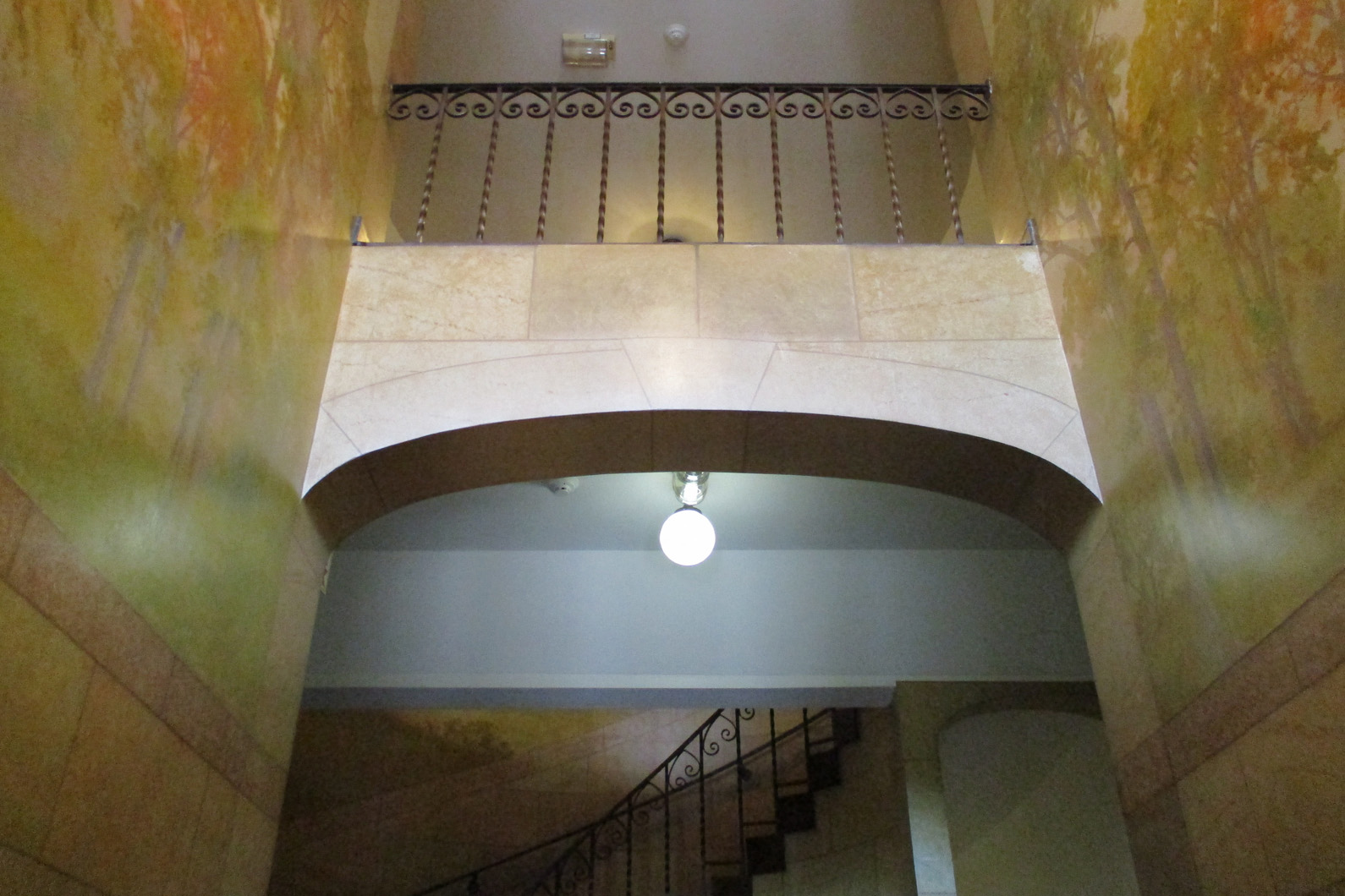 the inside of a building with stairs and a light