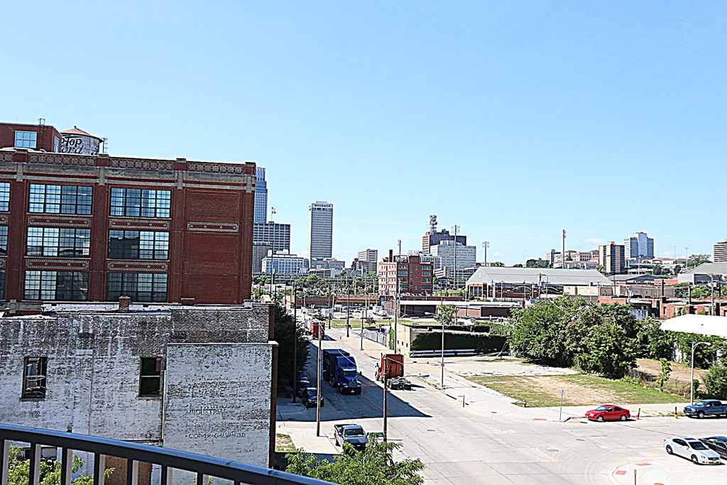 a view of the city from a balcony of a building