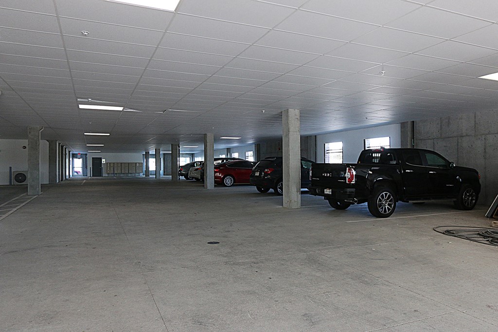 a parking garage with cars parked in it