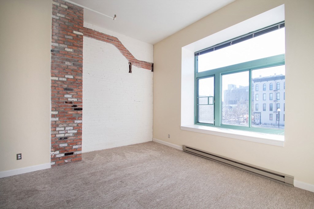 Architecturally Unique Floor Plans with Brick Accent Walls at The Greenhouse Apartments in Omaha, NE