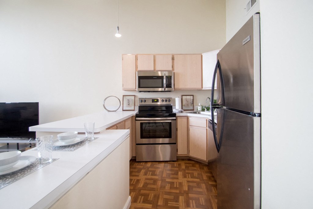 One Bedroom/One Bathroom: A3 Model Unit with light cabinets at The Greenhouse Apartments in Omaha, NE